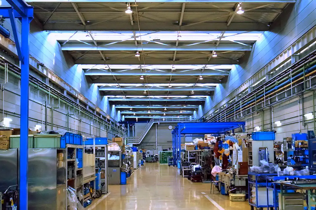 Large industrial factory hall, brightly lit.
